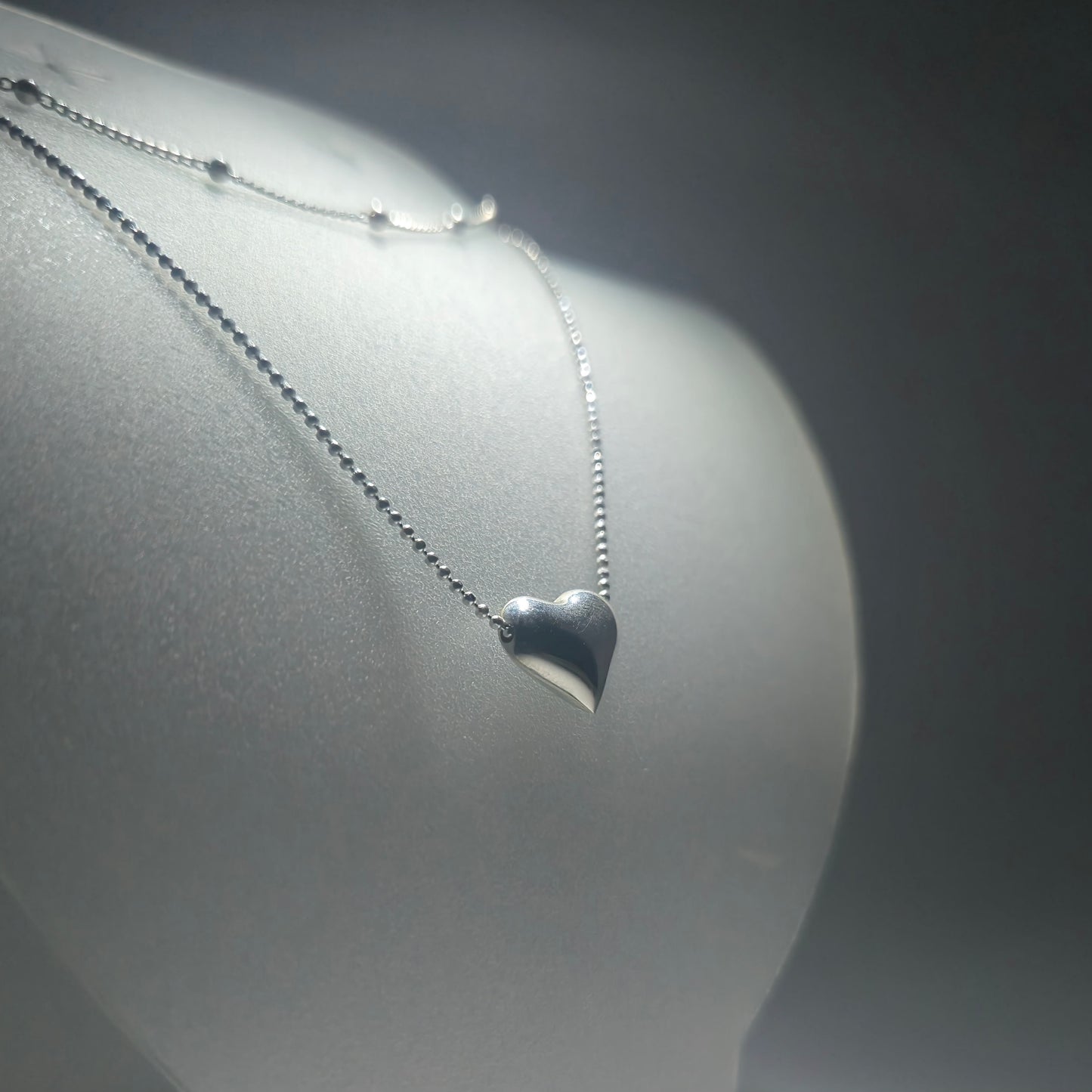 Silver double necklace with a chunky silver heart