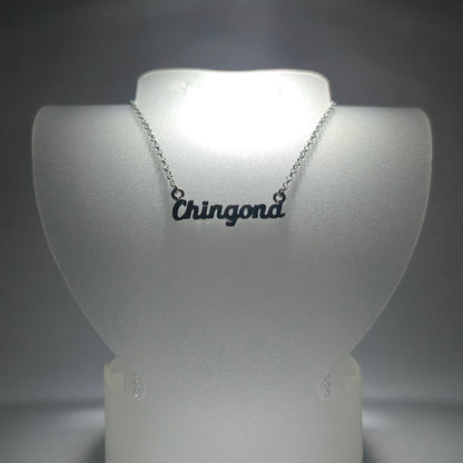 Silver chain necklace with the phrase "chingona" in silver