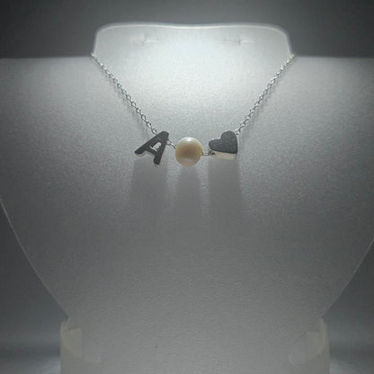 Sterling silver necklace with a pearl in between a silver heart and ANY LETTER