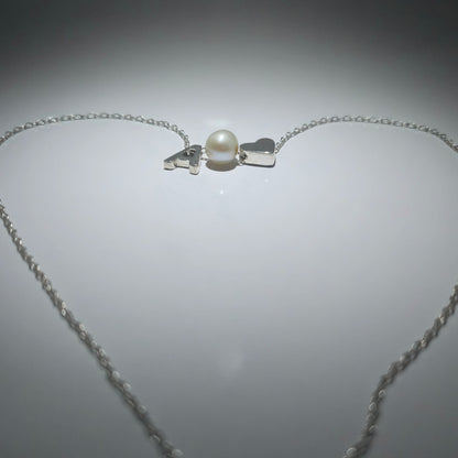 Sterling silver necklace with a pearl in between a silver heart and ANY LETTER