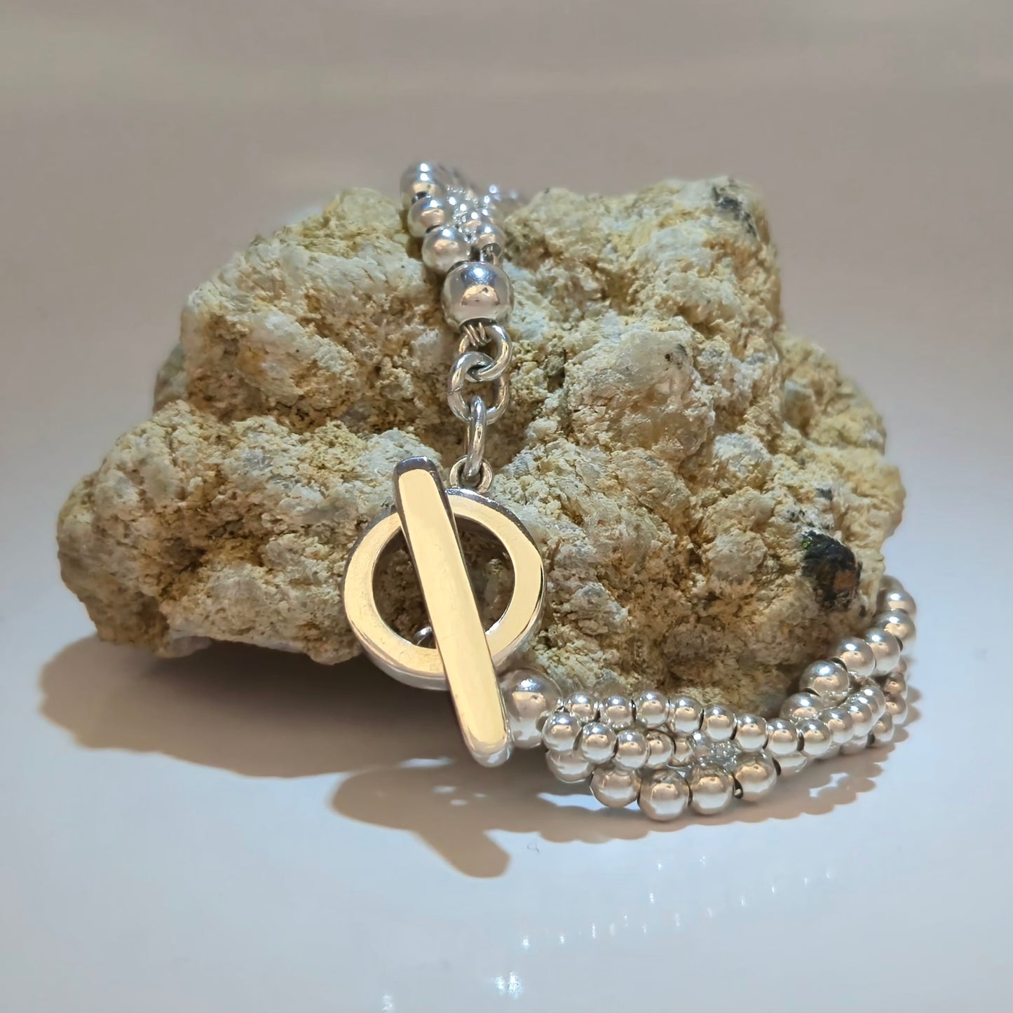 Silver beaded bracelet with open circle and silver bar