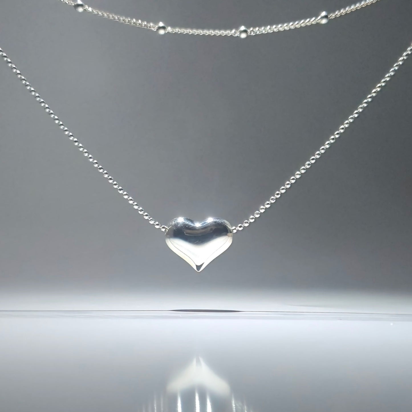 Silver double necklace with a chunky silver heart