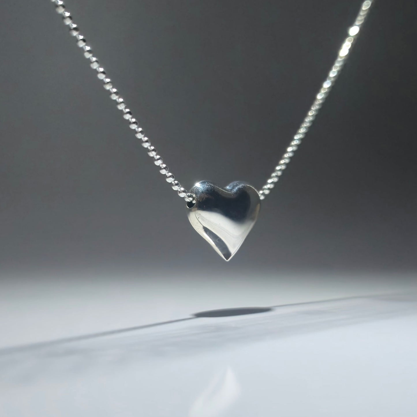 Silver double necklace with a chunky silver heart