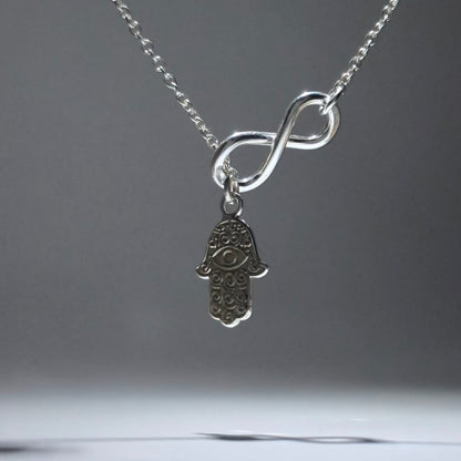 Silver Feather Pendant with infinity figure
