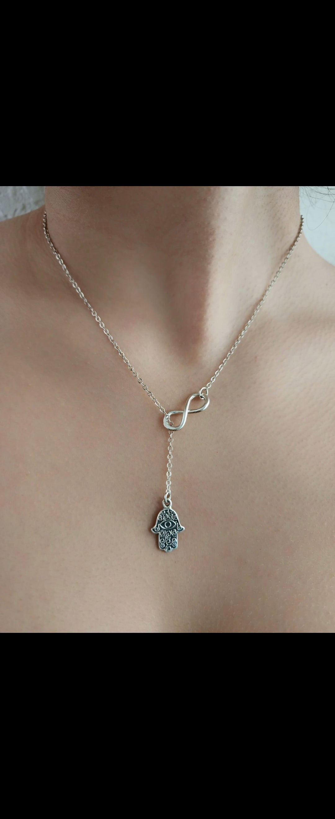Silver Feather Pendant with infinity figure