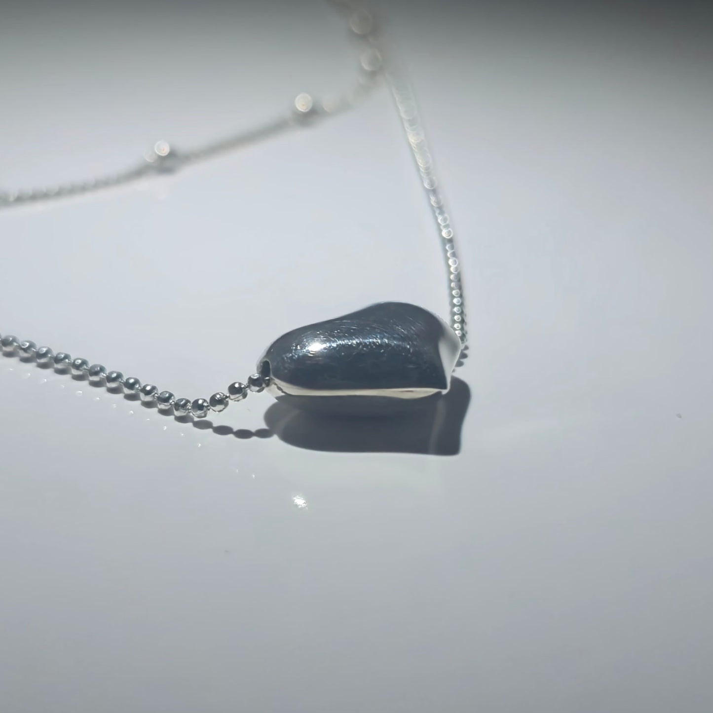 Silver double necklace with a chunky silver heart